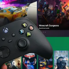 Dłoń trzyma kontroler Xbox, gotowa do gry. Na ekranie widać gry: Need for Speed Heat i Minecraft Dungeons. Kiedy nowy Xbox, to czas na nowe przygody!