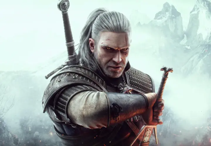 Geralt z Rivii, wiedźmin, z mieczem w dłoni, gotowy do walki. Jego spojrzenie mówi więcej niż wiele wiedźmin cytaty.