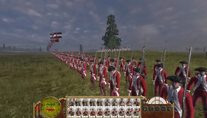 Żołnierze w czerwonych mundurach maszerują w formacji w grze Empire Total War. Flagi powiewają na wietrze.