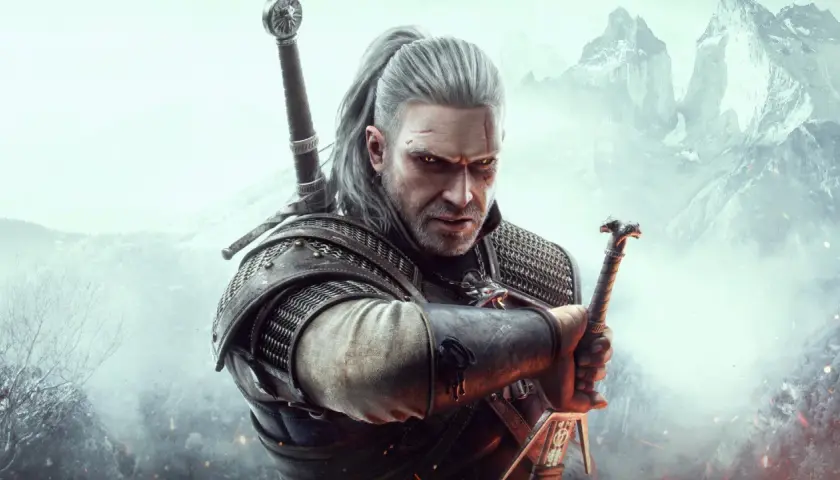 Geralt z Rivii, wiedźmin, z mieczem w dłoni, gotowy do walki. Jego spojrzenie mówi więcej niż wiele wiedźmin cytaty.